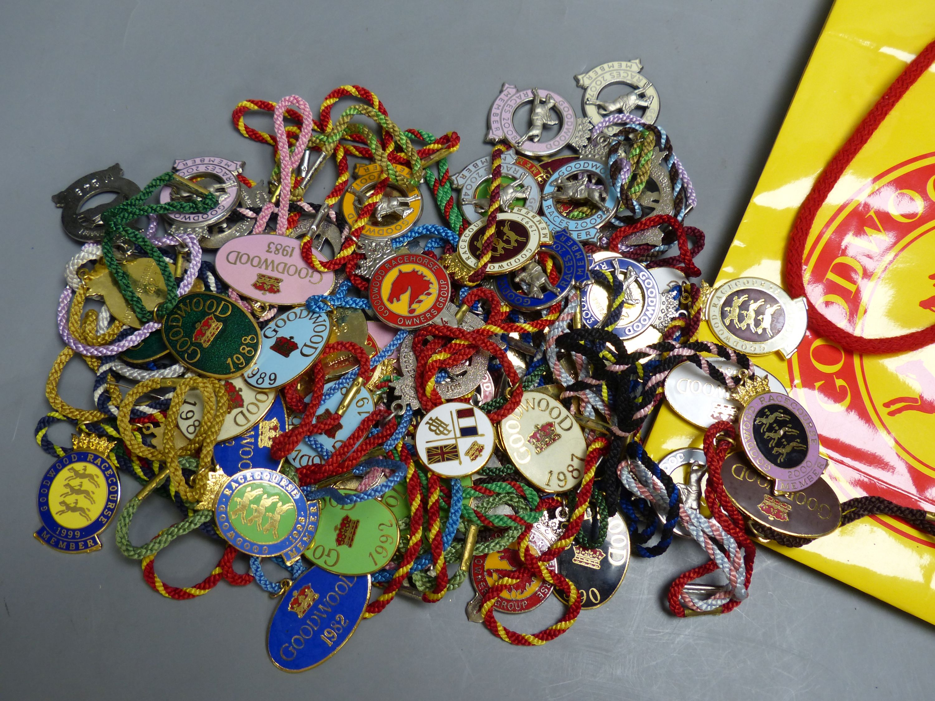 A collection of 60 Goodwood Racecourse Members enamelled badges, 1980's-2000's